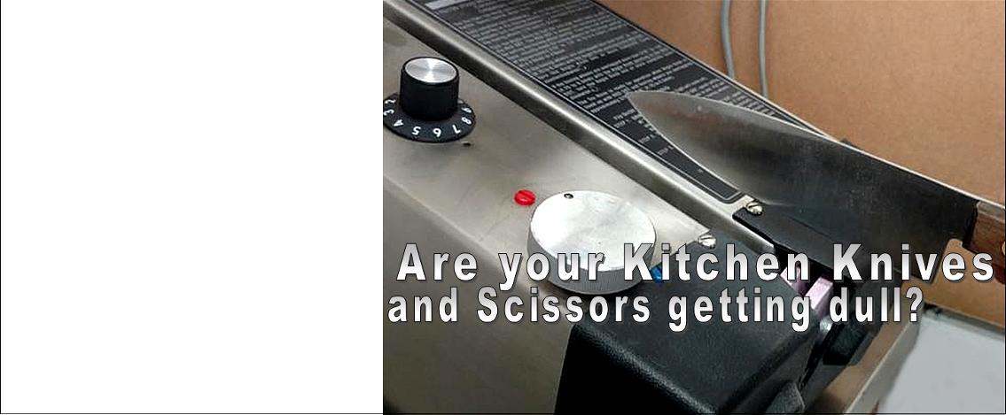 knife in foreground and bbq grill dials in the background